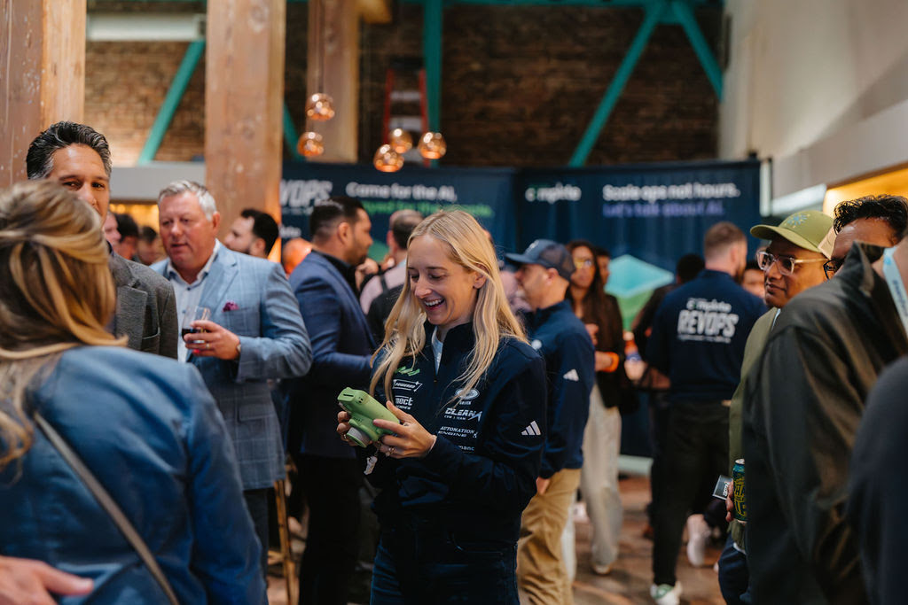 Attendees networking at the RevOps afterparty hosted by Traction Complete during Dreamforce 2025